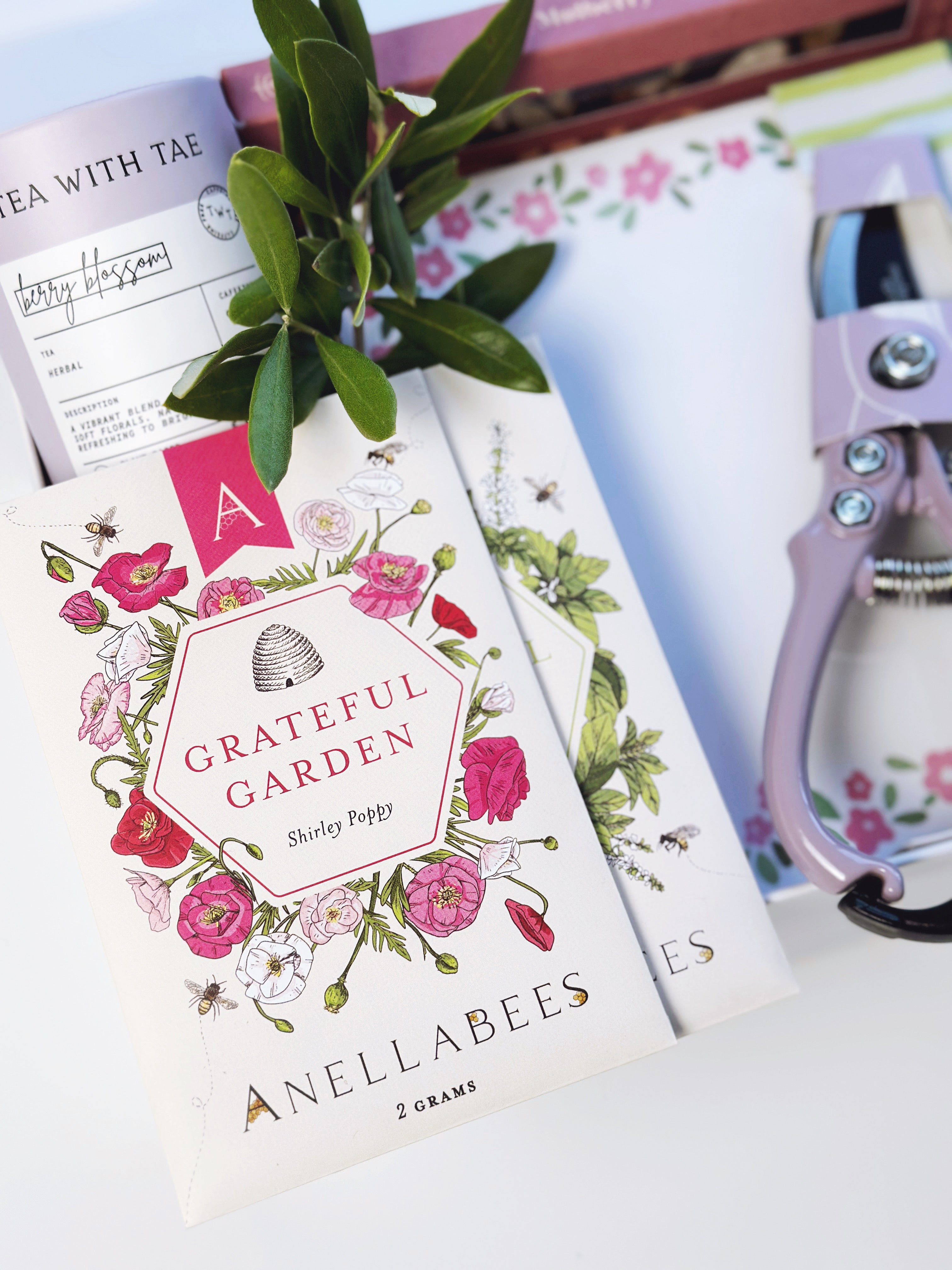 Poppins & Post Gardener's Gift box with gardening tools, seeds, and accessories arranged neatly inside a decorative gift box.