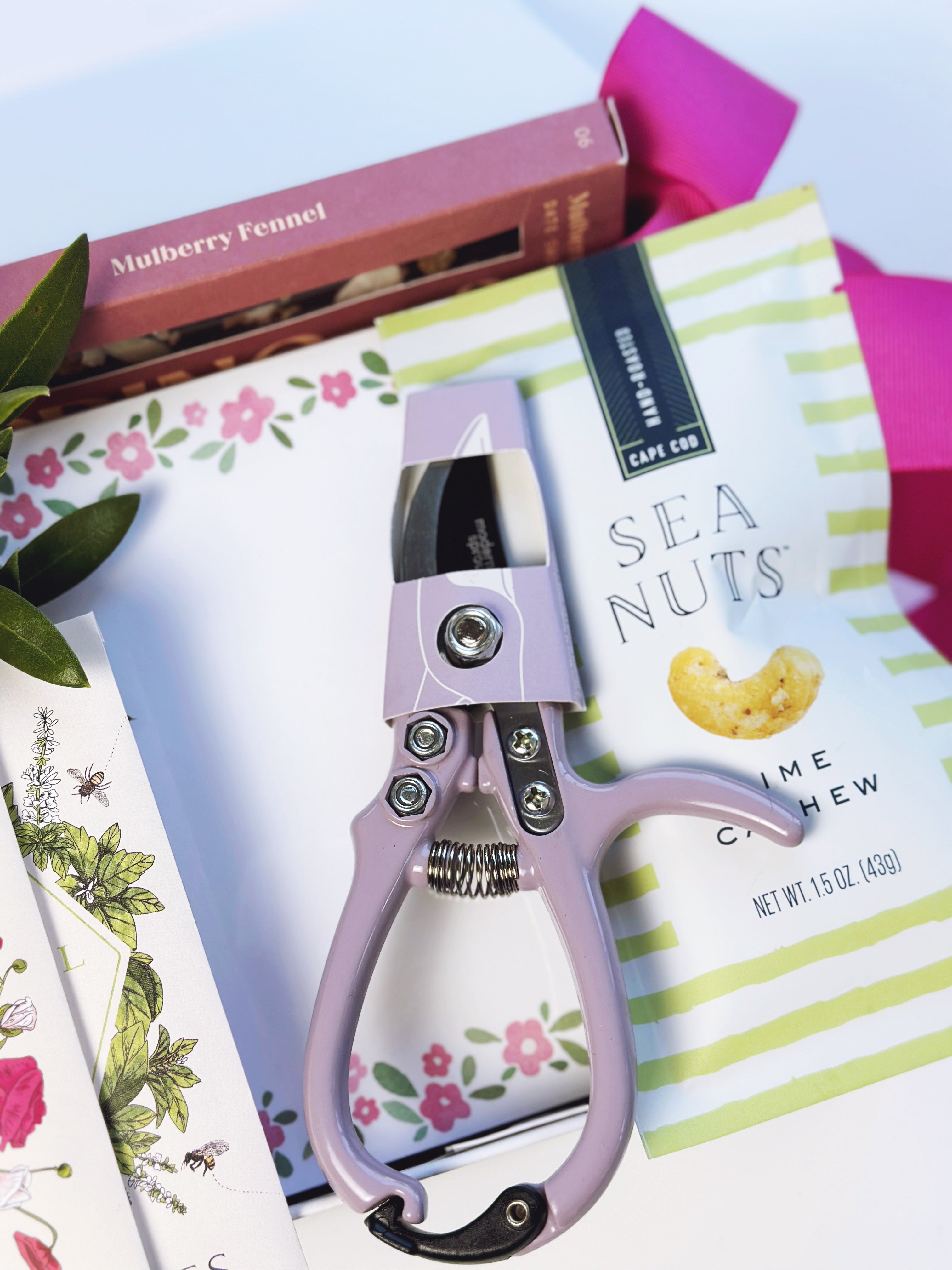 Poppins & Post Gardener's Gift box with gardening tools, gloves, and plant seeds in a decorative gift box.