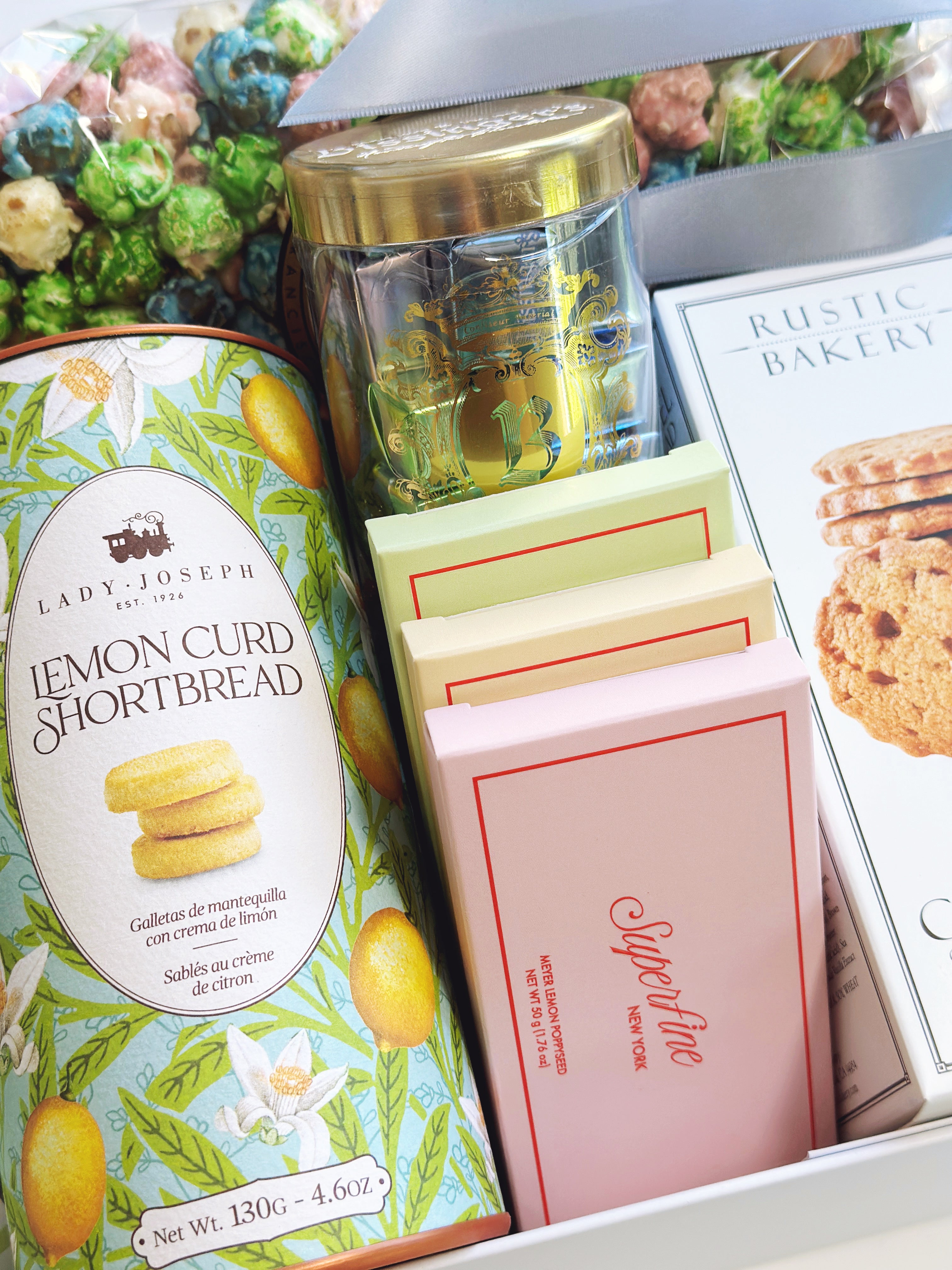 Poppins & Post Ultimate treat box gift box with assorted snacks and goodies, displayed in a stylish packaging.