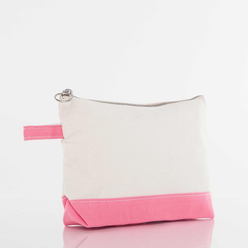 A canvas cosmetic pouch with a cream-colored upper section and a bright pink bottom base and zipper pull tab, featuring a silver metal zipper and a small silver ring pull.