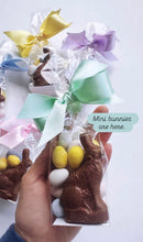 Mini Poppins & Post chocolate bunny candy with detailed bunny shape and smooth chocolate surface on a white background.