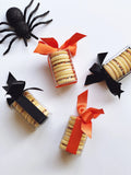 Four boxes of Poppins & Post buttercream sandwich cookies stacked together, showcasing colorful cookie packaging.