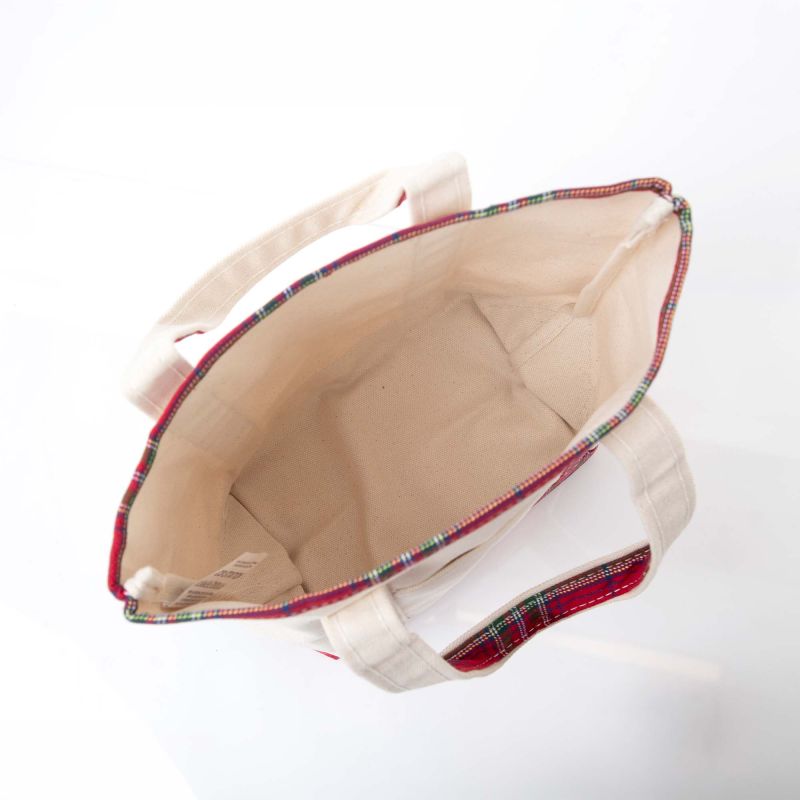 Beige tote bag with plaid trim on a white background