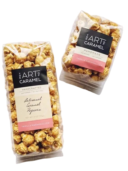 Two packages of 'The Art of Caramel' vanilla marshmallow popcorn on a white background.