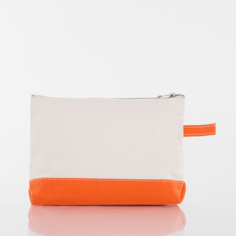 A rectangular zippered pouch with a cream canvas upper section and a bright orange bottom panel and matching orange wrist strap, shown on a clean white background with a soft reflection below.