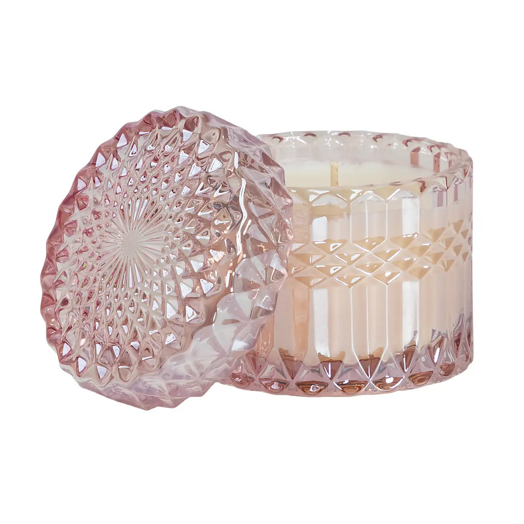 Pink chiffon crystal candle from Poppins & Post, elegantly gift-wrapped with a soft, glowing candle inside.