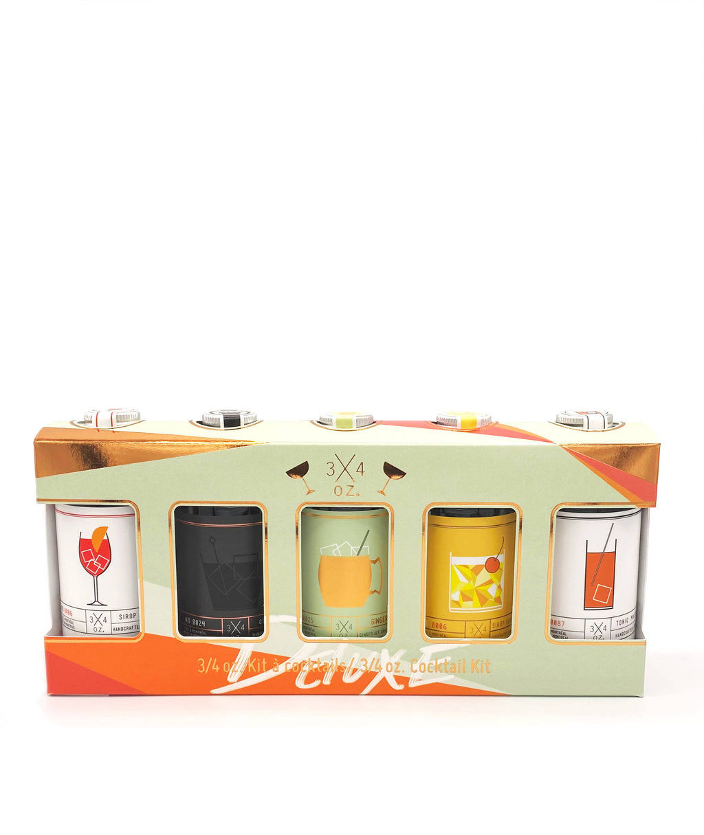 Deluxe cocktail and mocktail kit featuring 3/4 oz. tonic, with colorful ingredients and tools for creative mocktail mixing.