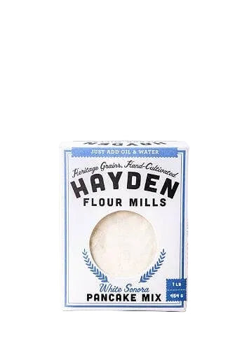 Hayden Flour Mills White Sonora Pancake Mix box on a beige surface with a white background