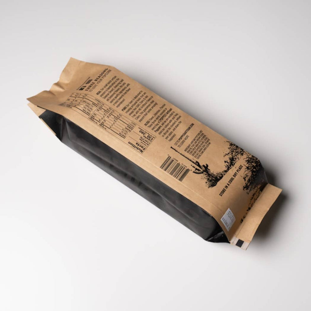 Brown paper package with text and a barcode on a white background