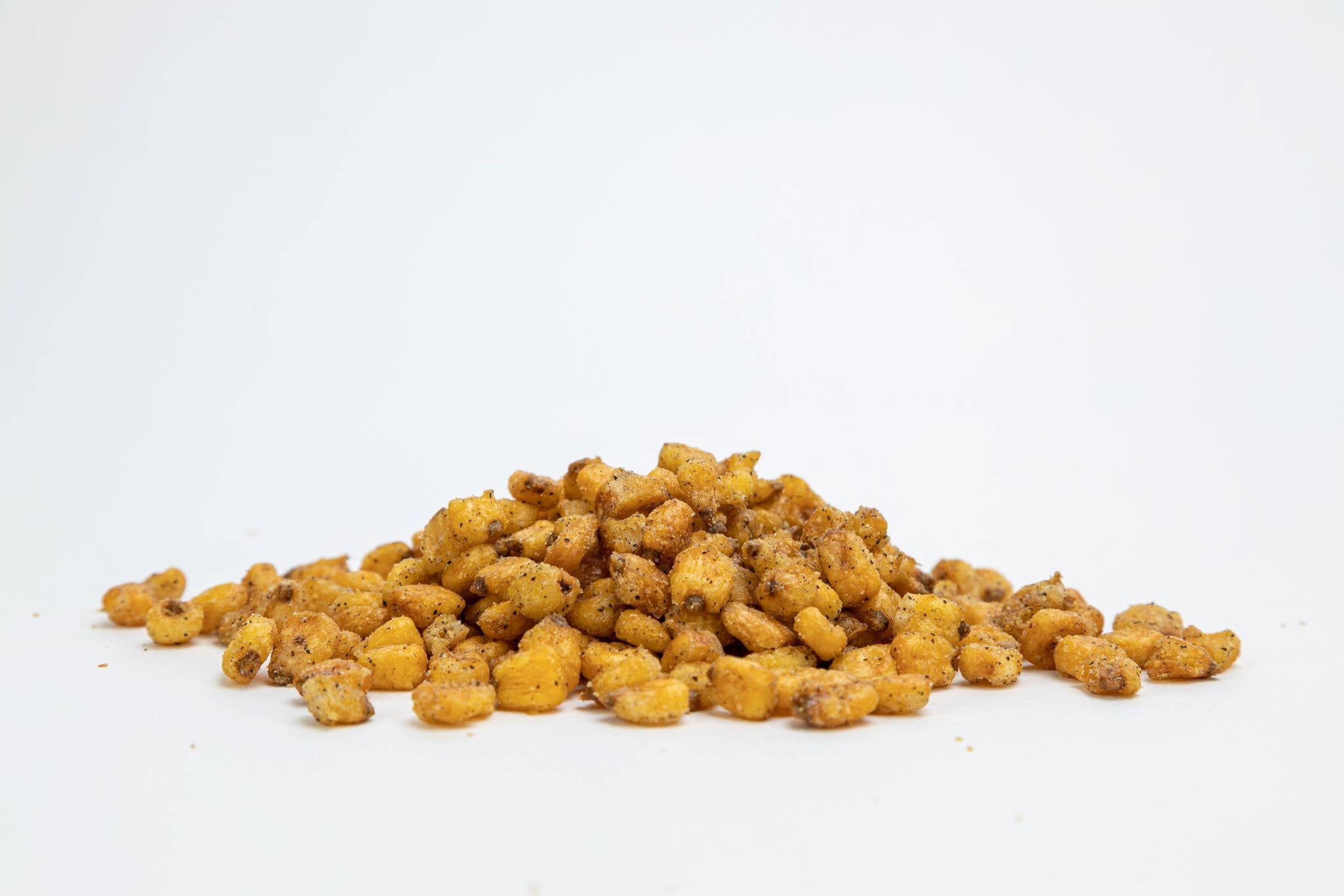 Albina City Nuts Salt & Pepper Toasted Corn snacks in a bowl, showcasing crispy, seasoned corn with salt and pepper seasoning.
