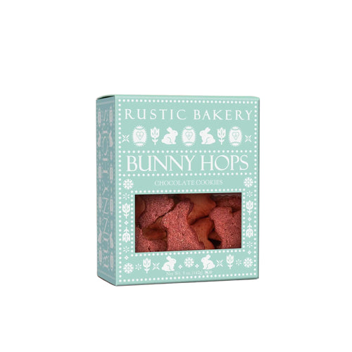 Box of 'Bunny Hops' chocolate cookies from Rustic Bakery on a light pink background