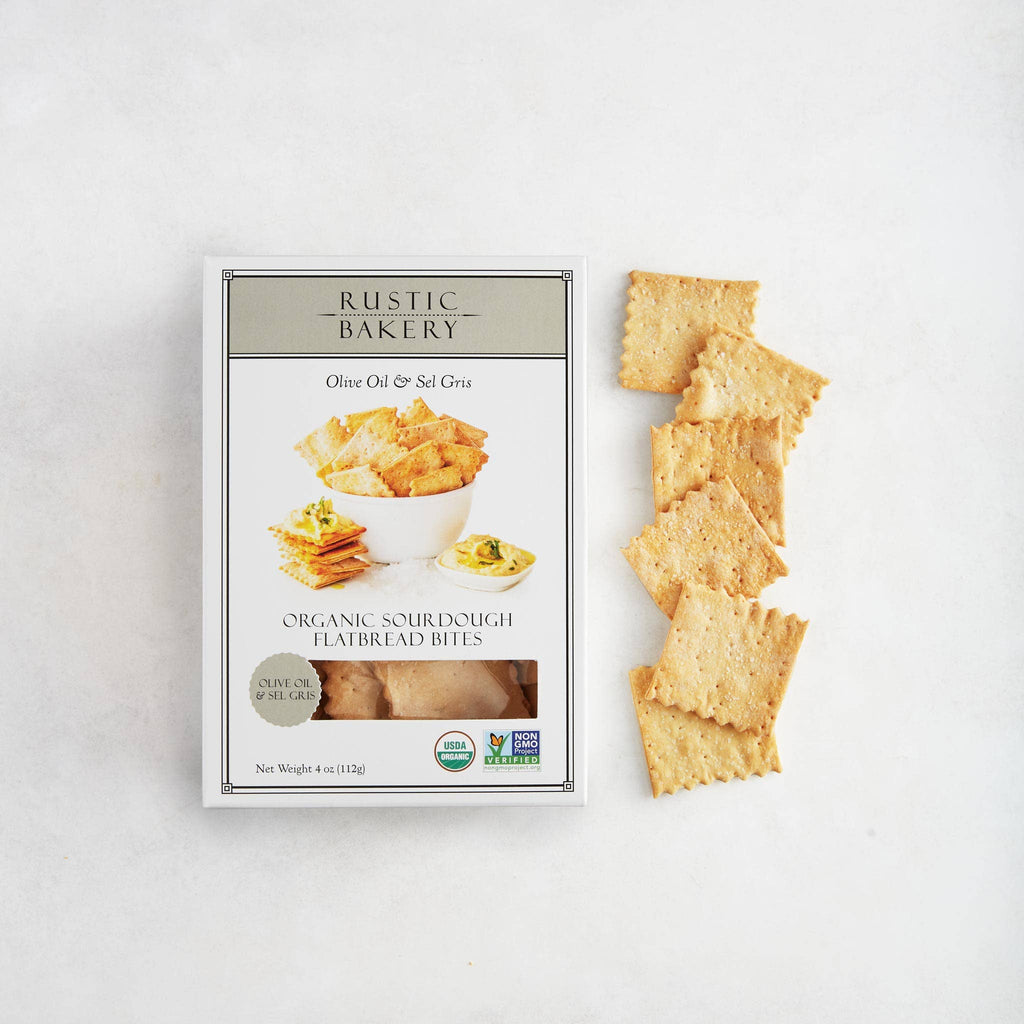 Rustic Bakery BITES olive oil and sel gris box with 12 snack packs, showcasing the packaging and product arrangement.