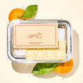 Superfine Chocolate Satsuma Creamsicle Bar featuring chocolate coating and orange-flavored candy filling on a white background.