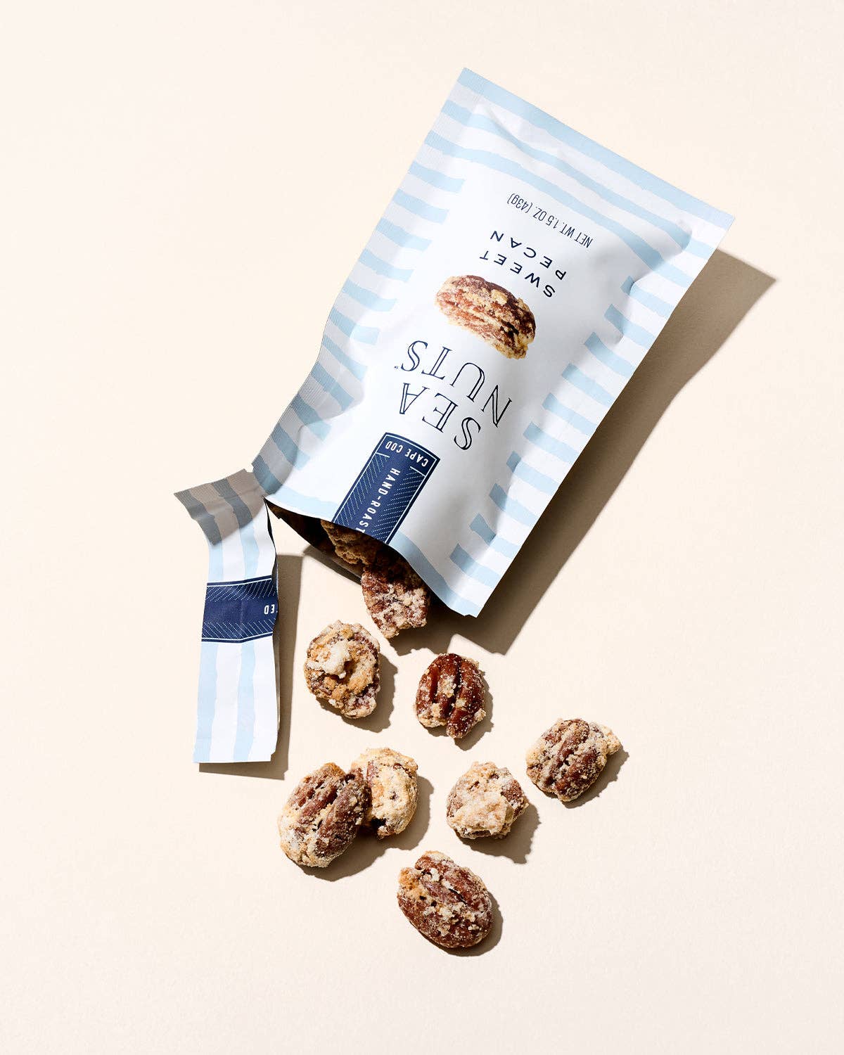 Sea Nuts brand sweet pecans in a bowl, showcasing golden roasted pecans with a glossy finish and rich texture.