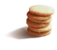 Lady Joseph Lemon Curd Shortbread Cookies, golden-brown cookies with lemon curd filling, on a white plate.