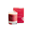 True Hue Peppermint Twist mini candle with red and white striped design and a lit flame, creating a cozy holiday ambiance.