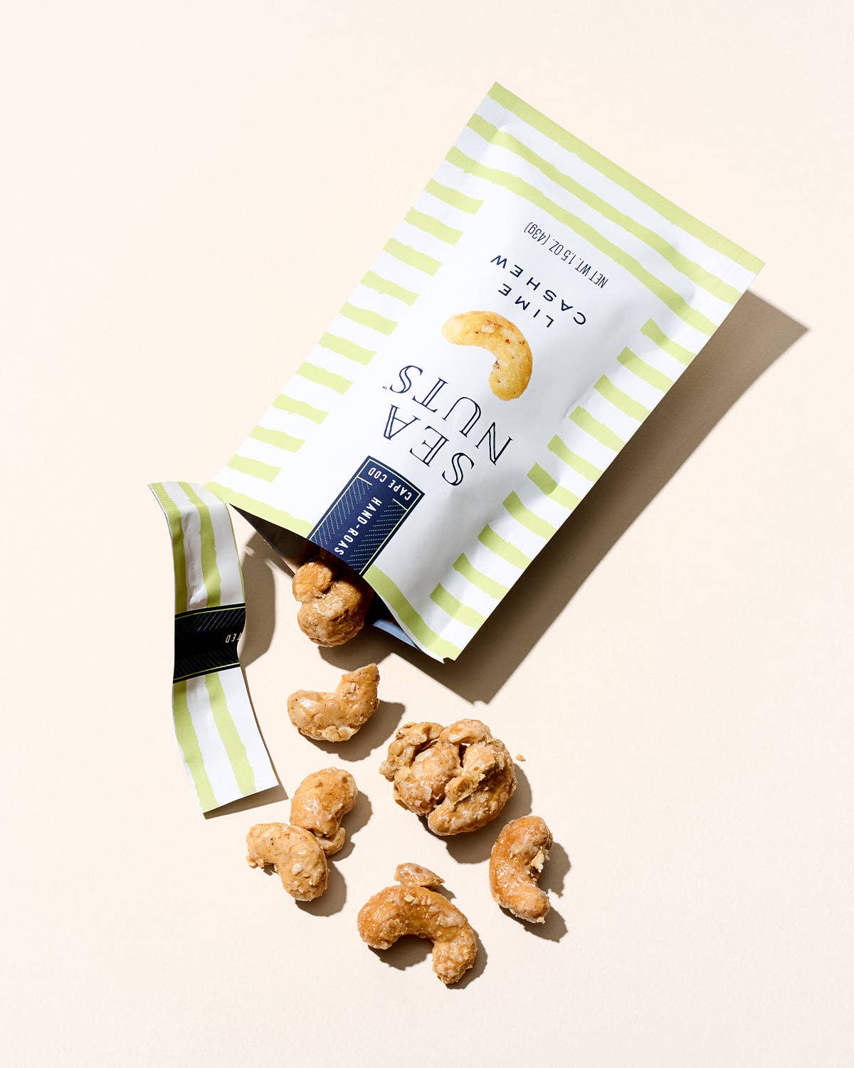 Sea Nuts Lime Cashews, crunchy roasted nuts flavored with zesty lime, shown in a close-up image.