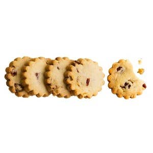 Rustic Bakery Pecan Shortbread Cookies on a plate, showcasing golden-brown, buttery cookies with pecan pieces.