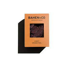 Bahen & Co. Confit Orange Chocolate bar with visible orange pieces and smooth chocolate surface, artisanal chocolate and candy.