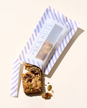 Sea Nuts Maddie's Chocolate Almond Walnut Granola Bar with visible almonds, walnuts, and chocolate chunks on a white background.