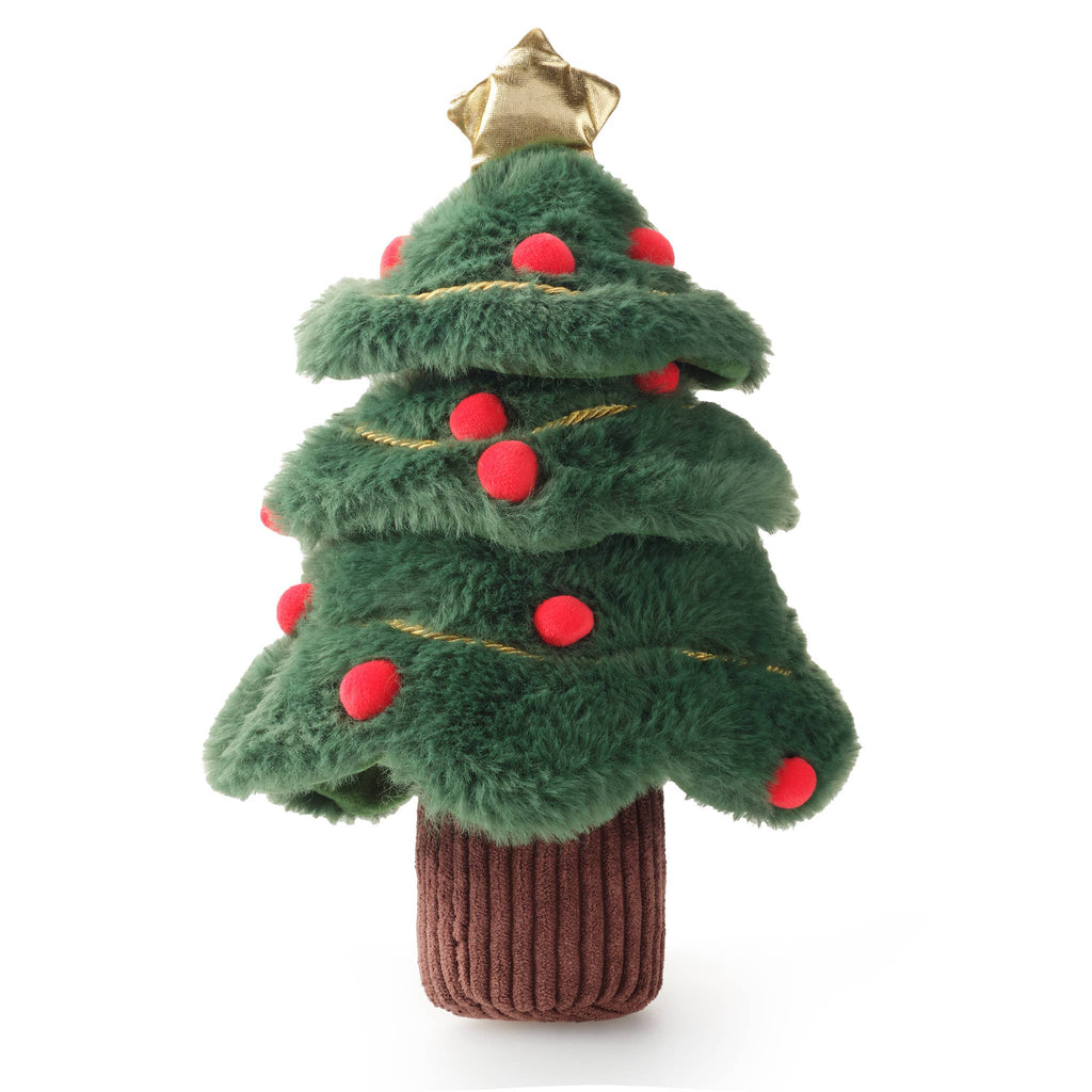 A plush Christmas tree toy with layered green faux-fur style branches, red pom-pom ornaments, a gold star topper, and a brown ribbed trunk, photographed on a plain white background.