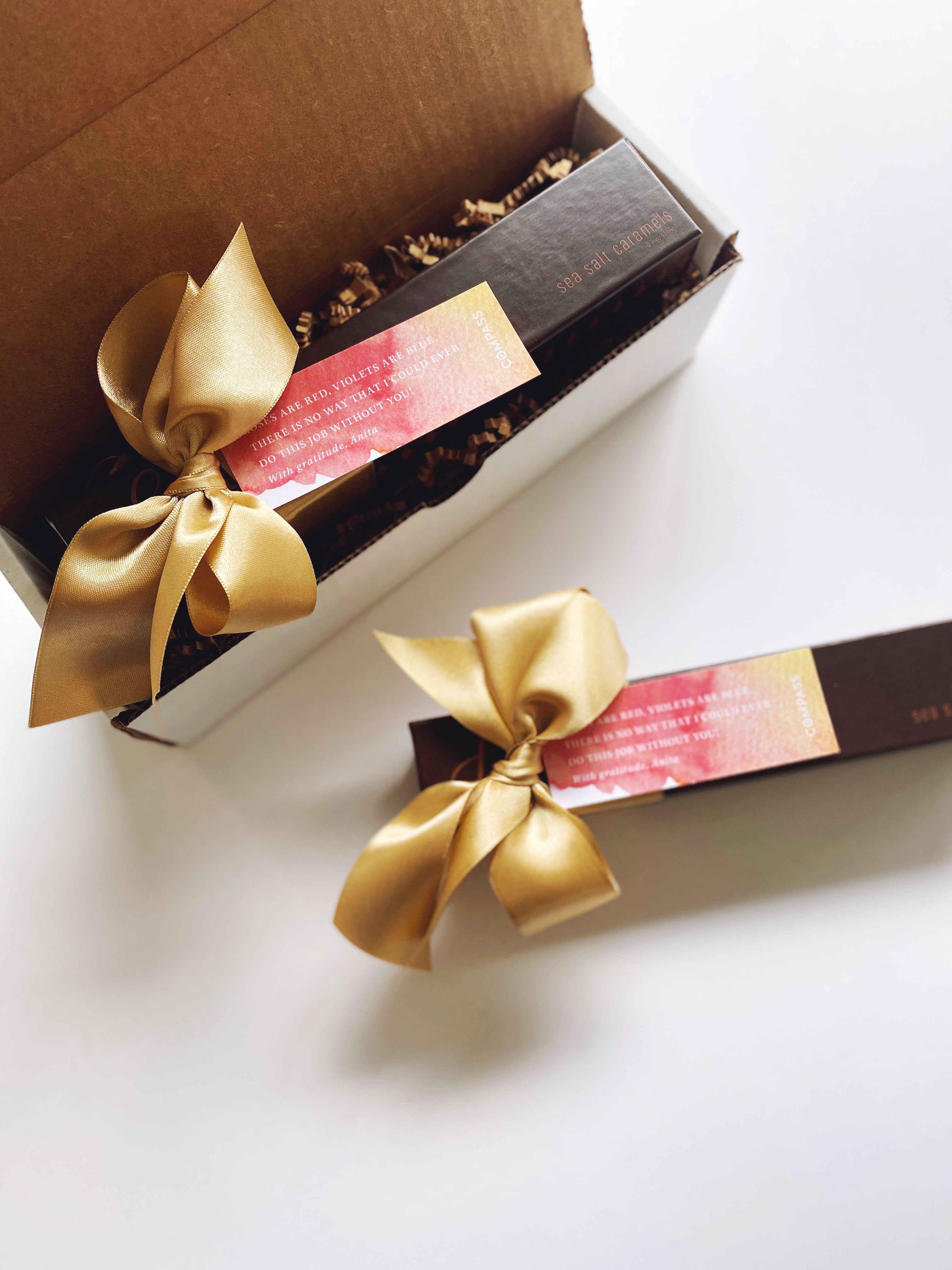 Assorted Lula's Sea Salt Chocolates by Poppins & Post, set of 10, arranged in a decorative gift box.